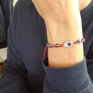 Hamsa hand and evil eye bracelet. Prosperity/Protection ancient symbols.